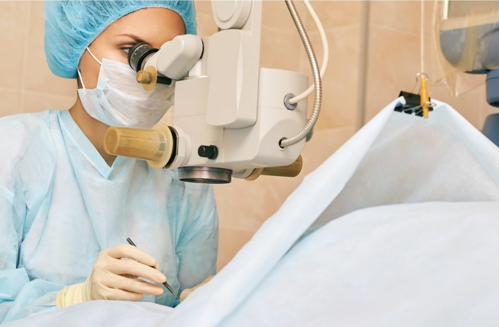 A female surgeon performing cataract surgery on a patient